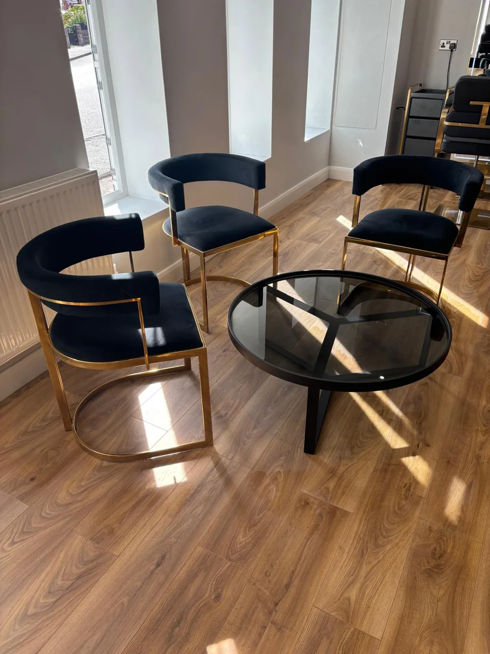 Seating area with black chairs in the Thorne salon