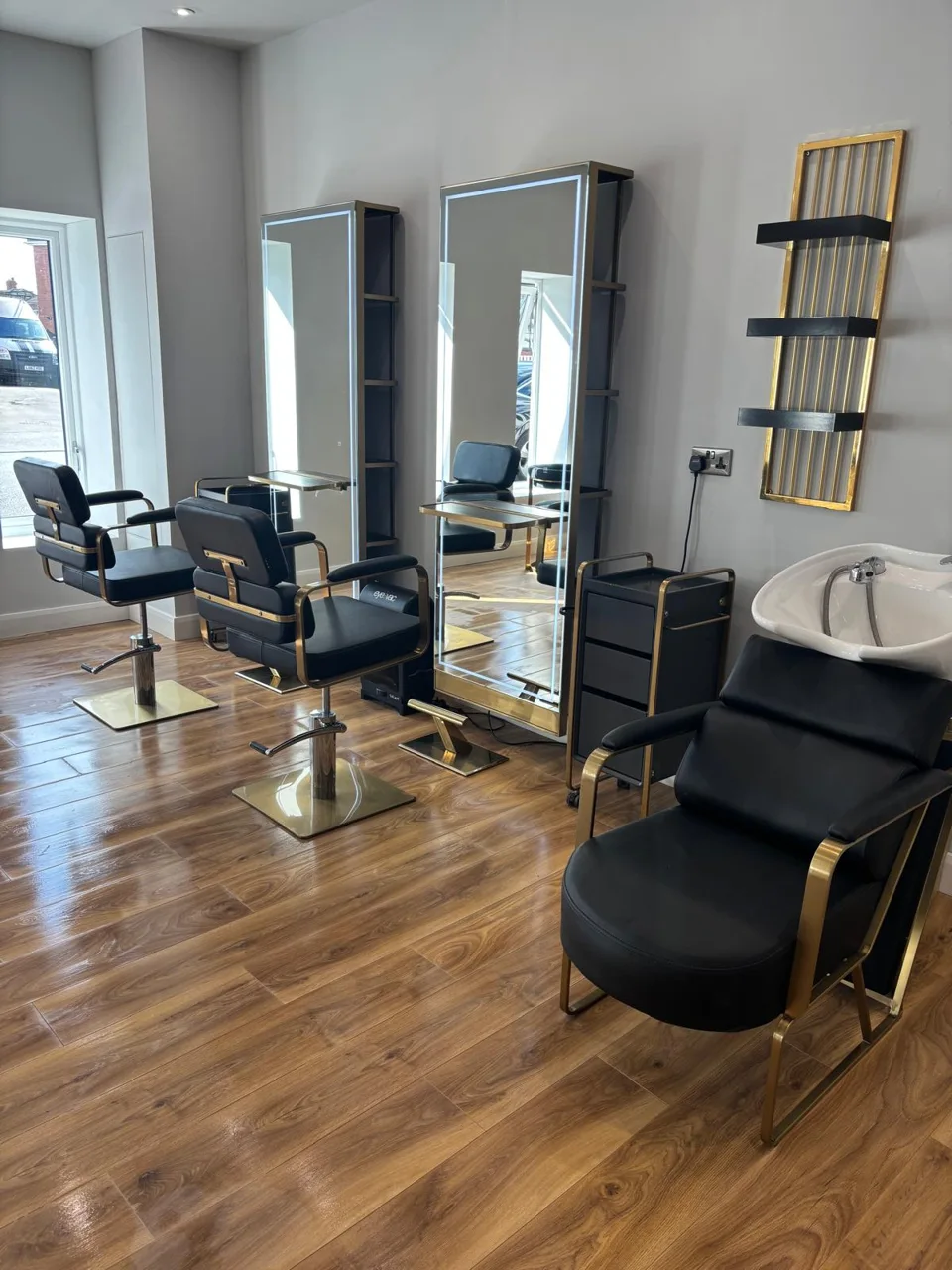 Mirrors and styling chairs along the salon floor