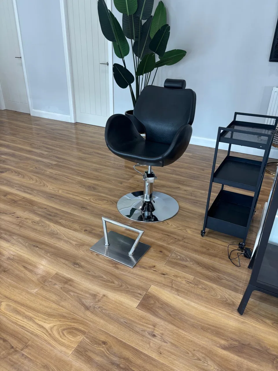 Salon chair beside a mirror and trolley at Brown & Co in Thorne